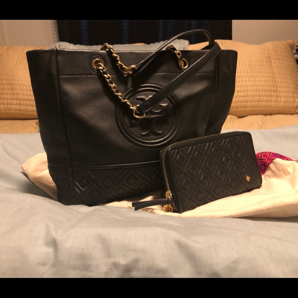 Black leather new condition Tory Burch and wallet.